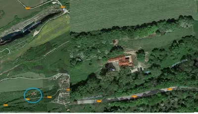 an aerial view of a house on a hill with a blue circle at 14 Century Water Mill in Mořina