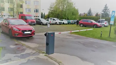 a parking lot with cars parked in a parking lot at Hotel Penzion Rohožník in Prague