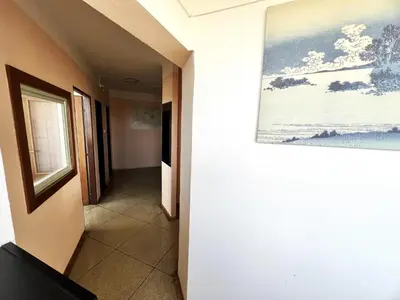 a hallway with a painting hanging on a wall at Hotel Penzion Rohožník in Prague