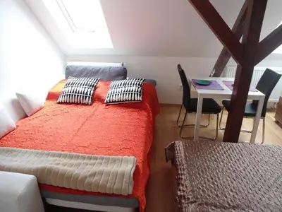 a kitchen with white cabinets and a sink and a microwave at Suite Ohrada in Prague
