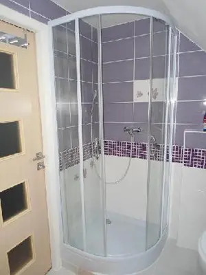 a bathroom with a sink with a green candle on it at Suite Ohrada in Prague