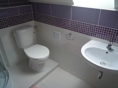 a small kitchen with a sink and a microwave at Suite Ohrada in Prague