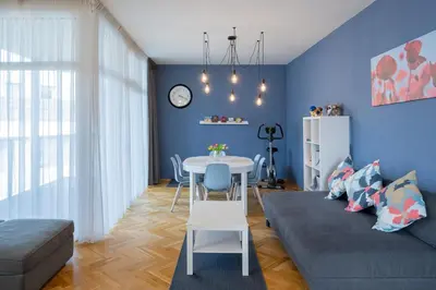 a living room with a couch and a table at Veleslavin Apartments in Prague