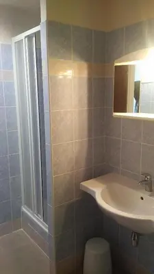 a bathroom with a sink and a mirror at Volha in Prague
