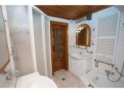 a bathroom with a sink and a tub and a toilet at CHATA Privlaky in Přívlaky
