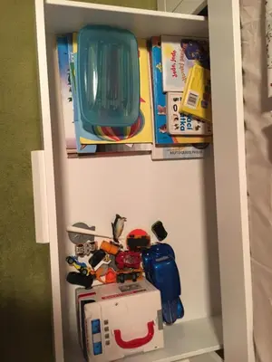 a toy cabinet filled with toys and other items at CHATA Privlaky in Přívlaky