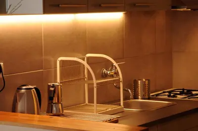a kitchen sink with a faucet on a counter at Panorama Prague Castle with Terrace in Prague