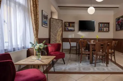 a living room with a couch and a table at Anyday Apartments in Prague