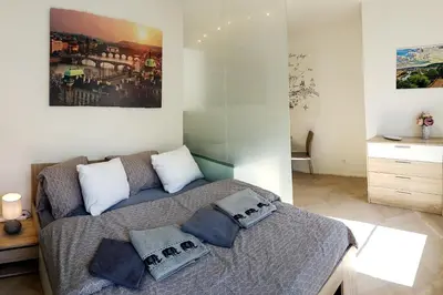 a bedroom with a bed with pillows on it at ONSITE Free Garage Parking, 10min Centre by Bus in Prague