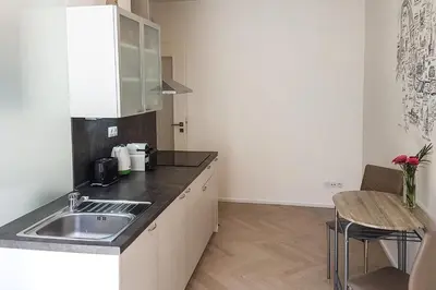 a kitchen with a sink and a counter top at ONSITE Free Garage Parking, 10min Centre by Bus in Prague