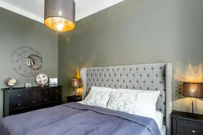 a bedroom with a purple bed with two night stands and two lamps at Luxury apartment at Prague city centre Anděl! in Prague