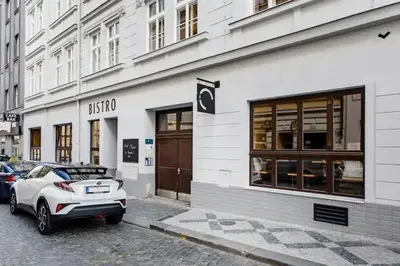 a white car parked in front of a building at Luxury apartment at Prague city centre Anděl! in Prague