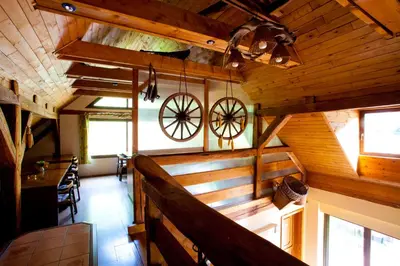 an inside view of a cabin with wooden walls and windows at Motel Svatý Kryštof in Liběchov