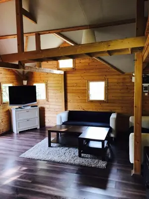 a living room with a couch and a coffee table at Summer lake in Chotilsko