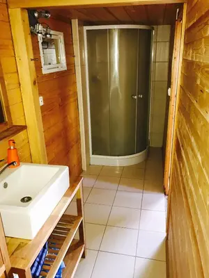 a bathroom with a sink and a shower at Summer lake in Chotilsko