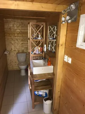 a bathroom with a sink and a toilet at Summer lake in Chotilsko