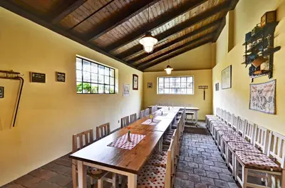 a large room with a long table and chairs at Penzion Na Letním bytě in Kouřim