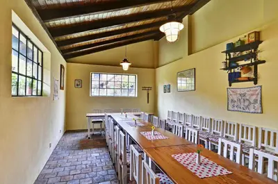 a large room with a long table and chairs at Penzion Na Letním bytě in Kouřim