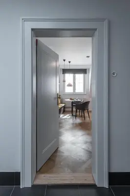 a door leading into a room with a dining room at Exclusive Old Town residence near Charles Bridge in Prague