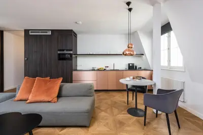 a living room with a couch and a table at Exclusive Old Town residence near Charles Bridge in Prague
