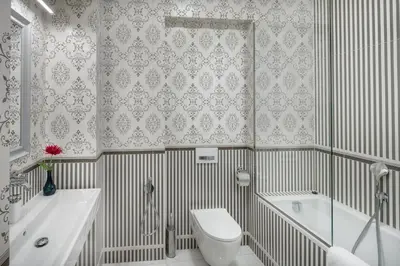 a bathroom with a tub and a toilet and a sink at Mikulášská - Old Town Square View Residence in Prague