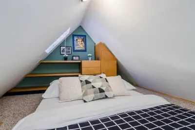 a bedroom with a bed in a attic at Old Town Square Apartments by Michal&Friends in Prague