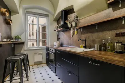 a kitchen with a sink and a counter top at Old Town Square Apartments by Michal&Friends in Prague