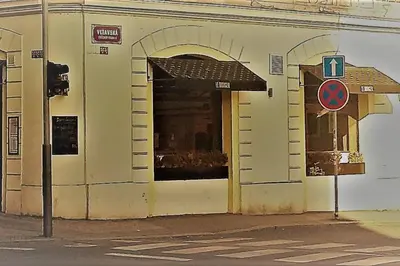 a building with an open door on a street at NOT POSSIBLE TO BOOK Apartment Vltavska F in Prague