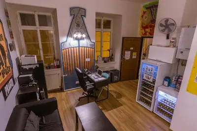 an empty room with a barber shop with chairs and aperature at The MadHouse Prague in Prague