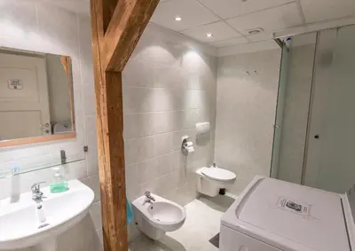 a bathroom with a sink and a toilet at The MadHouse Prague in Prague