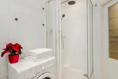 a bathroom with a washing machine and a shower at Prague APT near Charles Bridge by Michal&Friends in Prague