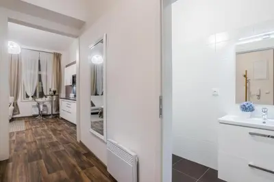 a bathroom with a sink and a mirror at Prague APT near Charles Bridge by Michal&Friends in Prague