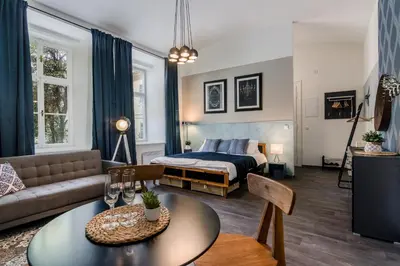 a living room with a bed and a table at Prague APT near Charles Bridge by Michal&Friends in Prague