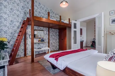 a bedroom with a loft bed and a staircase at Prague APT near Charles Bridge by Michal&Friends in Prague