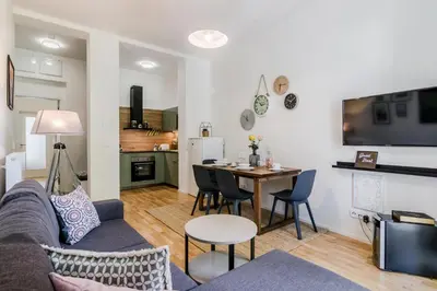 a living room with a couch and a table at Zizkov APT Prague by Michal&Friends in Prague