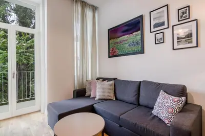 a living room with a couch and a table at Zizkov APT Prague by Michal&Friends in Prague