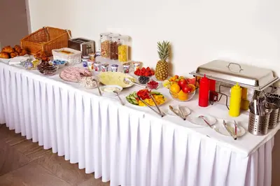 a white table with food on top of it at Penzion Lesni in Milovice