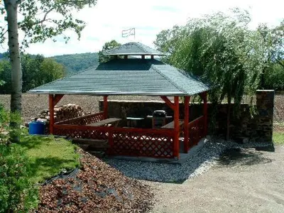 a gazebo with a roof on top of it at Hotel Kolonie in Křivoklát