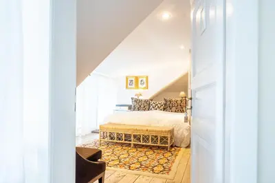 a bedroom with a bed and a window at Family Hotel Okoř in Okoř
