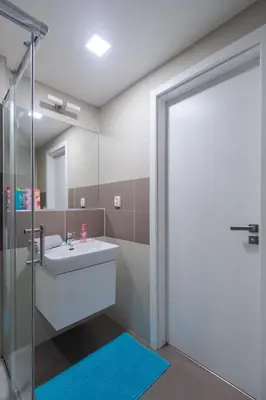 a bathroom with a sink and a mirror at Bright Studio, 10min Centre, Free Parking in Prague