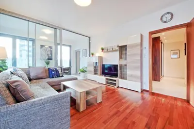 a living room with a couch and a table at OL apartments in Prague