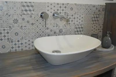 a white bowl sink on a counter in a bathroom at Apartmany U Stareho Labe in Nymburk