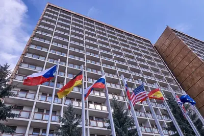 a group of flags in front of a building at Hotel Krystal in Prague