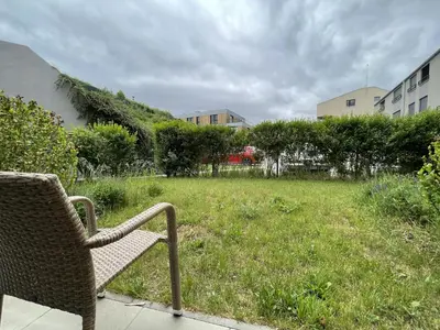 a picnic table in a yard with a gazebo at Hotel Panská Zahrada in Dobřichovice