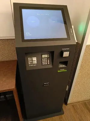 a video game machine with a screen in a room at Hotel Zlatá Váha in Prague