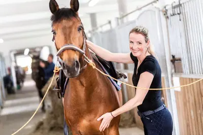 a woman is standing next to a horse at Bílichov in Bílichov
