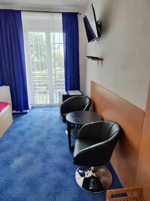 a waiting room with two chairs and a table at Hotel O.K. 1 in Beroun