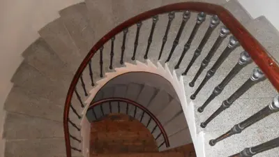 a spiral staircase in a building at Jungmann Hotel in Prague