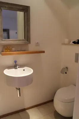 a bathroom with a sink and a toilet at Jungmann Hotel in Prague