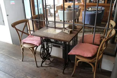 a table and two chairs in front of a mirror at Jungmann Hotel in Prague